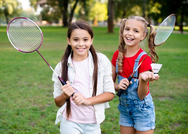 cheerful-girls-holding-badminton-rackets-hand_23-2148308788.jpg